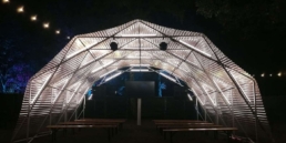 A scissor structure with light design by A03 for a stage by night.
