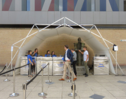 beautiful covered structure used as ticketing booth with people