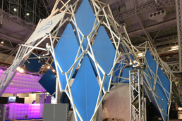 Scissor Structure with blue panels as fair booth